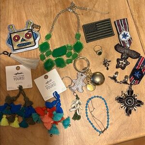 Lot of jewelry, including bag, charms, and military pins